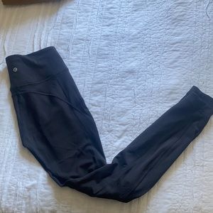 Black lulu lemon leggings with slits in the knee